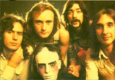 Early 70's Classic Genesis Lineup. From Left to Right: Banks, Collins (above), Gabriel (Make-up), Hackett, Rutherford
